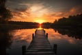 Wooden pier on the lake at sunrise. Beautiful nature background.