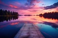 Wooden pier on a lake at sunset. Beautiful summer landscape, Small boat dock and beautiful sunset landscape view with a huge lake