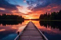 Wooden pier on the lake at sunset. Beautiful summer landscape, Small boat dock and beautiful sunset landscape view with a huge