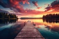 Wooden pier on the lake at sunset. Beautiful summer landscape, Small boat dock and beautiful sunset landscape view with a huge Royalty Free Stock Photo