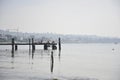 Wooden pier leading out into calm tranquil lake water