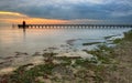 Wooden pier and lighthouse in Lignano