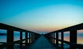 Long boardwalk pier by the sea at sunset Royalty Free Stock Photo