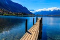 Wooden pier overlooking the Alps and Lake Geneva, Switzerland Royalty Free Stock Photo