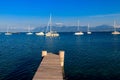 Wooden pier overlooking the Alps and Lake Geneva, Switzerland Royalty Free Stock Photo