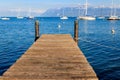 Wooden pier overlooking the Alps and Lake Geneva, Switzerland Royalty Free Stock Photo