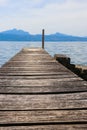 Wooden pier overlooking the Alps and Lake Geneva, Switzerland Royalty Free Stock Photo