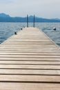 Wooden pier overlooking the Alps and Lake Geneva, Switzerland Royalty Free Stock Photo