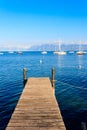 Wooden pier overlooking the Alps and Lake Geneva, Switzerland Royalty Free Stock Photo