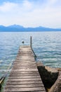 Wooden pier overlooking the Alps and Lake Geneva, Switzerland Royalty Free Stock Photo