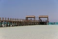 Wooden pier on Paradise island and a boat Royalty Free Stock Photo