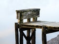 Wooden pier with pilings over milky water