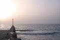 Wooden pier with pillars on the summer twilight beach Royalty Free Stock Photo