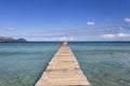 A wooden pier at Playa de Muro beach in Mallorca Royalty Free Stock Photo