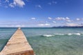 A wooden pier at Playa de Muro beach in Mallorca Royalty Free Stock Photo