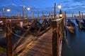 Wooden pier with poles, Venice Royalty Free Stock Photo