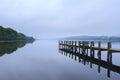 Wooden pier in a quiet foggy day Royalty Free Stock Photo