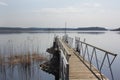 a wooden pier on a quiet serene lake. Peaceful rural landscape Royalty Free Stock Photo