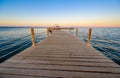 Wooden Pier on Red Sea in Hurghada at sunset and luxury yacht, View of the promenade boardwalk - Egypt, Africa Royalty Free Stock Photo