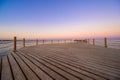 Wooden Pier on Red Sea in Hurghada at sunset and luxury yacht, View of the promenade boardwalk - Egypt, Africa Royalty Free Stock Photo