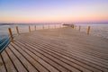 Wooden Pier on Red Sea in Hurghada at sunset and luxury yacht, View of the promenade boardwalk - Egypt, Africa Royalty Free Stock Photo