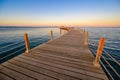 Wooden Pier on Red Sea in Hurghada at sunset and luxury yacht, View of the promenade boardwalk - Egypt, Africa Royalty Free Stock Photo