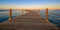 Wooden Pier on Red Sea in Hurghada at sunset and luxury yacht, View of the promenade boardwalk - Egypt, Africa Royalty Free Stock Photo