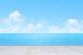 Wooden pier beside sea. clouds sky background. Royalty Free Stock Photo