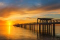 Wooden pier between sunset in Phuket, Thailand. Royalty Free Stock Photo
