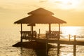 Wooden pier between sunset in Phuket, Thailand. Royalty Free Stock Photo