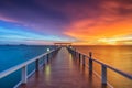 Wooden pier between sunset