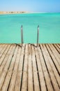 Wooden pier with swim ladder, tropical summer vacation concept