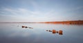 Wooden pier throug the lake Royalty Free Stock Photo