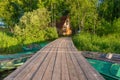 Wooden pier to the fisherman`s house on the shore Royalty Free Stock Photo