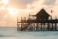 Wooden pier on a tropical beach at sunrise, Zanzibar