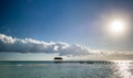 Wooden pier on a tropical island, clear sea , blue sky and clouds. Early morning. Cuba Royalty Free Stock Photo
