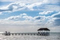 Wooden pier on a tropical island, clear sea , blue sky and clouds. Early morning. Cuba Royalty Free Stock Photo