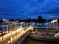 Wooden pier in Twilight beautiful sea with ship, view river and fishing boat of Mahachai Samut Sakhon Thailand Royalty Free Stock Photo