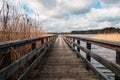 Wooden pier at waterside - straight wood dock walkway at lake