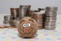 Wooden pig with coin stacks background, Saving money concepts, Investment concepts