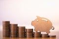 Wooden pig and stack of coins. Pension fund. Royalty Free Stock Photo