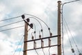 Wooden pillar with electric wires and insulator Royalty Free Stock Photo