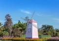 Wooden pink wildmill in public park