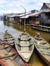 Wooden pirogues and houses on stilts