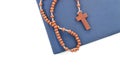 Wooden plain rosary on Bible. Royalty Free Stock Photo