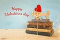 Wooden plane with heart on the stack of old books Royalty Free Stock Photo