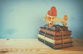 Wooden plane with heart on the stack of old books Royalty Free Stock Photo