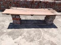 wooden plank on bricks for sitting people on this plank. These type of bench used in rural area's shops schools and houses. Royalty Free Stock Photo