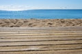 Wooden plank table with free space for your product or advertising text. Seaside scenery.