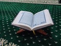 wooden plank used to put the holy book of Muslims Al-Quran. carpet background for prayer Royalty Free Stock Photo